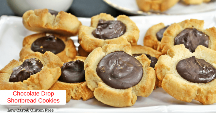 A picture of plated shortbread cookies with chocolate drop centers. 