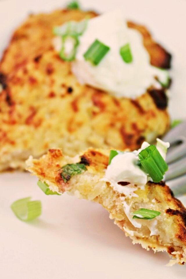 Two Cauliflower Cake with a bite on a fork.