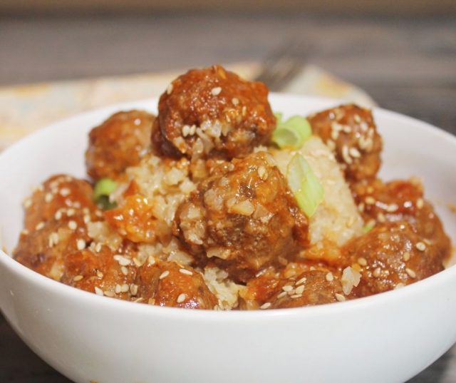 Tangy Sesame Meatballs Over Cauliflower Rice In a White Bowl, Close Up Picture of Meatballs