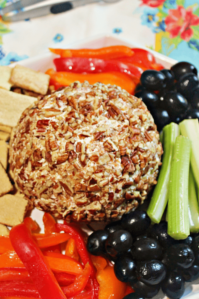 Keto Bacon Ranch Cheese Ball served with olives, veggies, and low carb crackers.