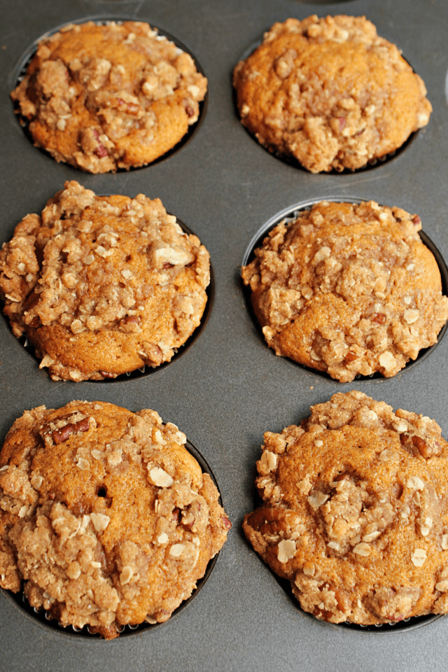 Muffin Pan full of Pumpkin Muffins with Brown Sugar Crumble