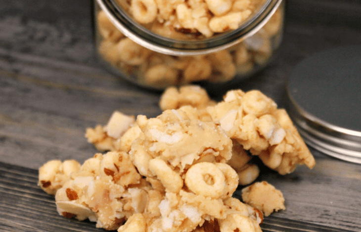 White Chocolate Cereal Snack Mix In Front of a Snack Jar