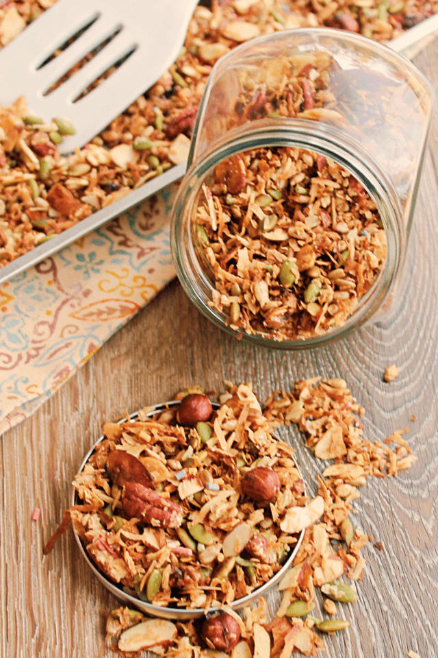 A Jar of Granola with a serving laid out.