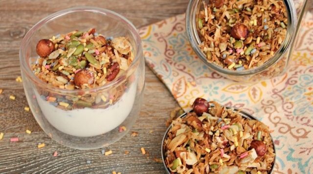 A cup of keto yogurt topped with birthday cake granola.