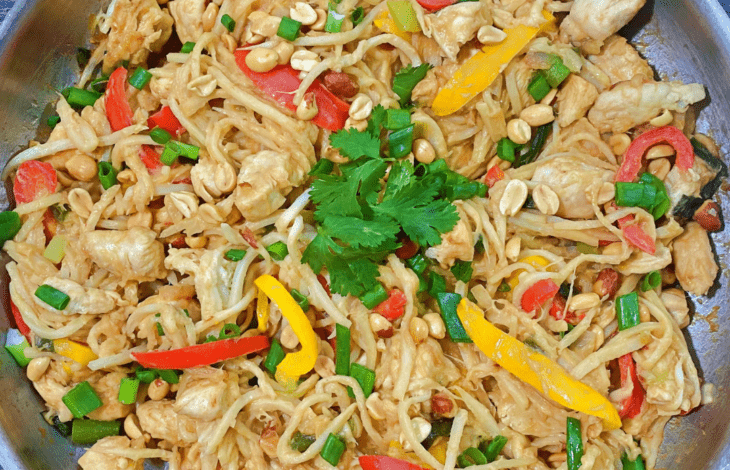 Chicken Pad Thai with noodles, peppers, onions, and chicken breast.