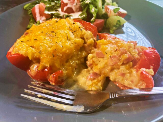 stuffed red pepper with cheese on top