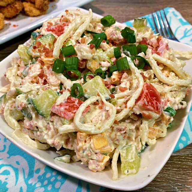 A large white bowl of low carb pasta salad