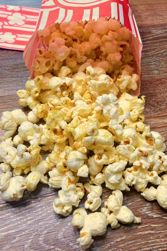 A popcorn bag spilling out popcorn
