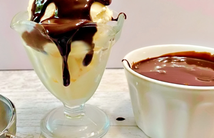 A ice cream sundae with sugar free chocolate fudge sauce on the top.