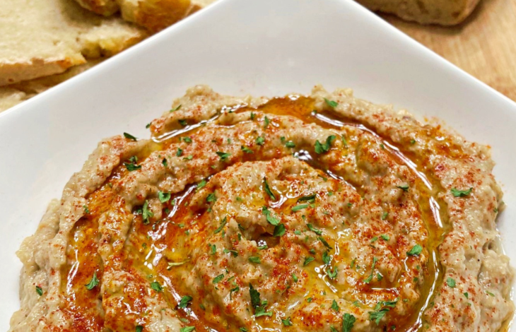 A close up look at Roasted Eggplant Dip in a white bowl.